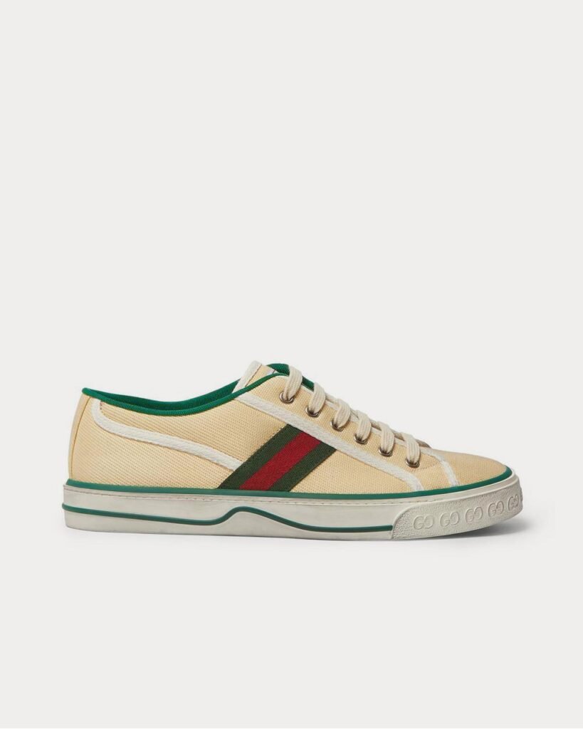 Baskets basses Gucci en toile et sangles effet vieilli crème