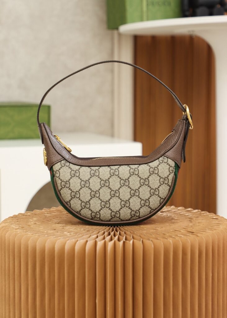 Gucci Ophidia GG sac demi-lune à bande Web