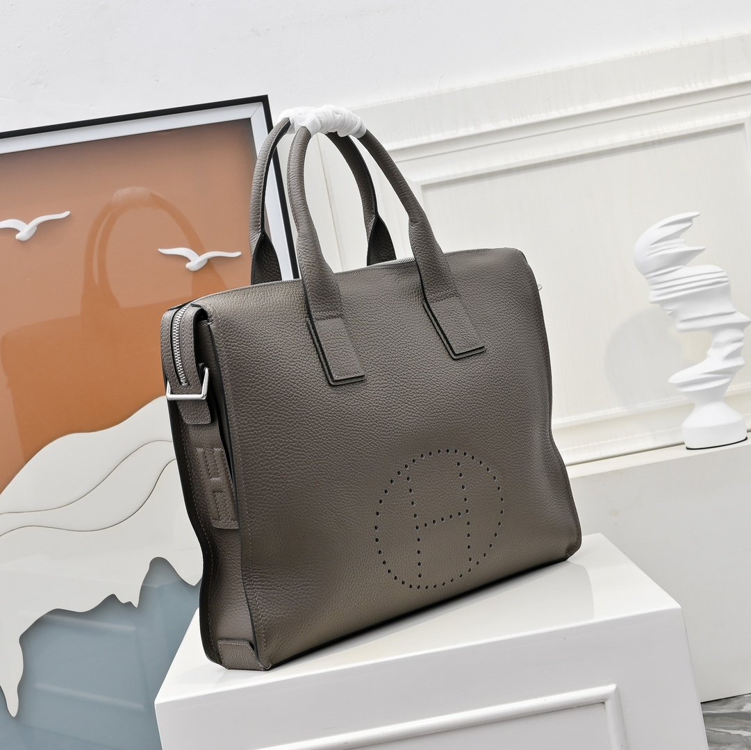 Hermès sacoche à poignées et H perforé