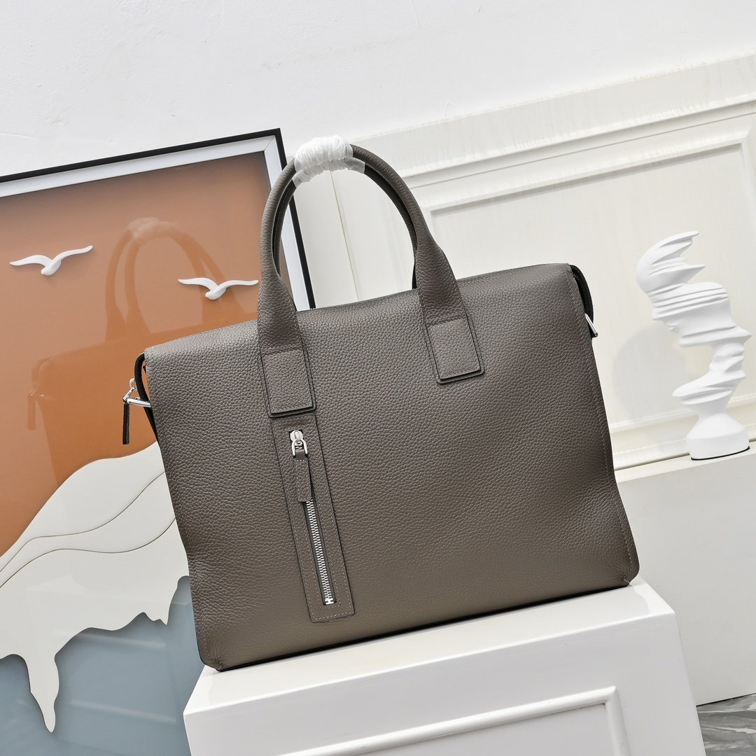 Hermès sacoche à poignées et H perforé