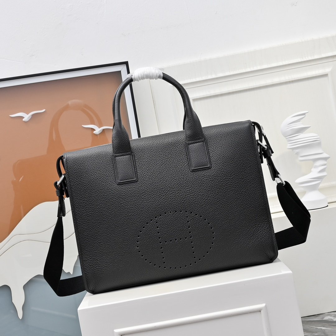 Hermès sacoche à poignées et H perforé