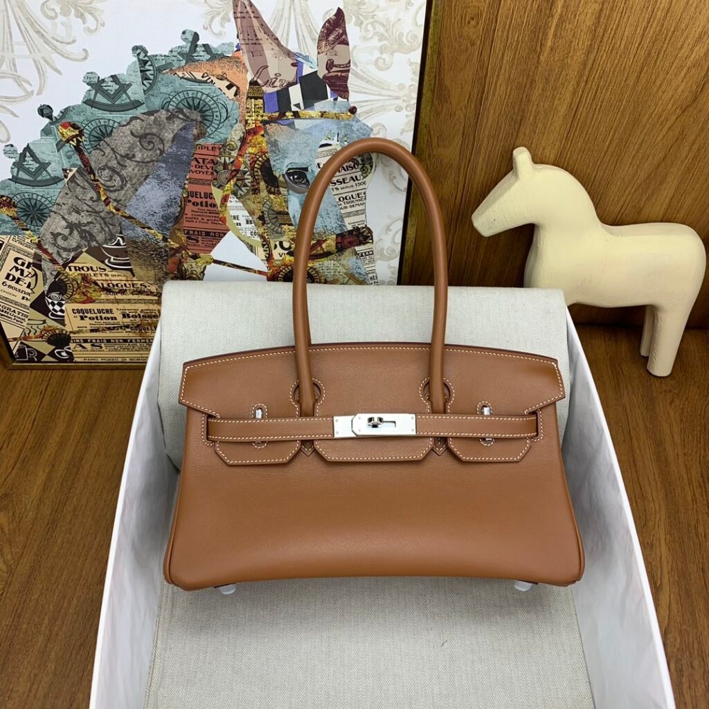 Hermès sac à main allongé à sanglons