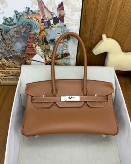 Hermès sac à main allongé à sanglons
