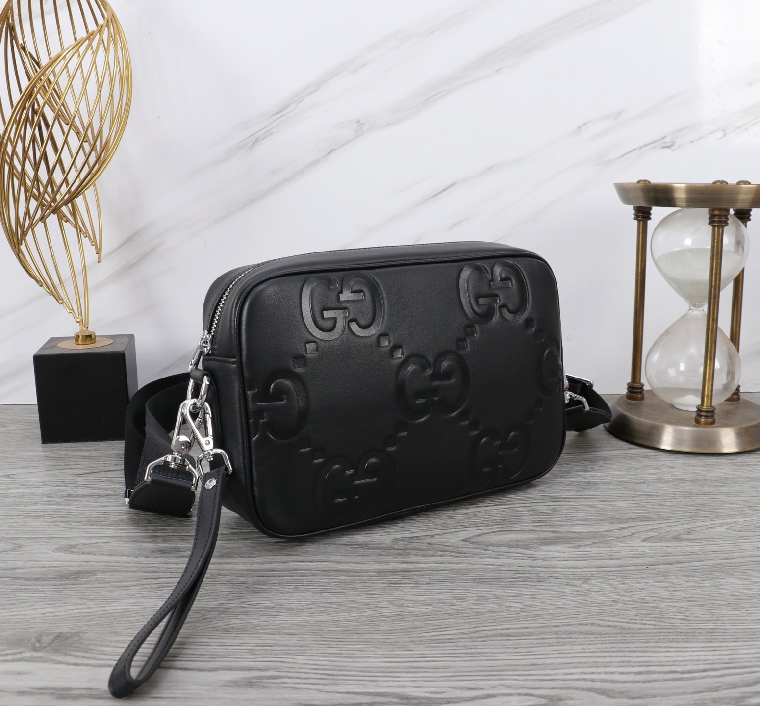 Gucci Sacoche bandoulière GG embossée noire