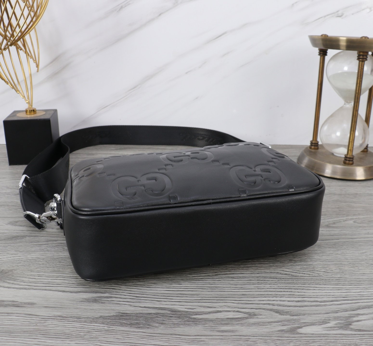 Gucci Sacoche bandoulière GG embossée noire
