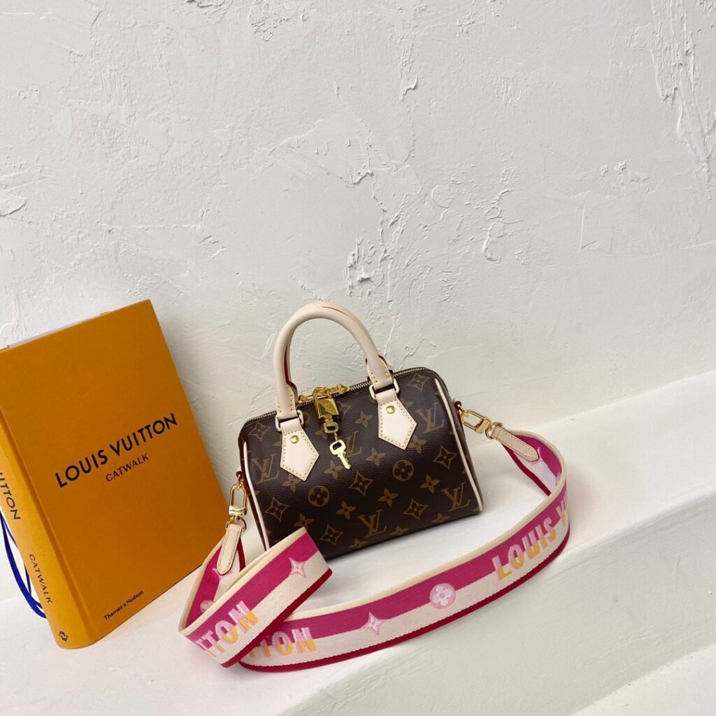 Louis Vuitton Speedy Bandoulière 20 20,5 × 13,5 × 12 cm – Monogram marron – bandoulière rose fuchsia