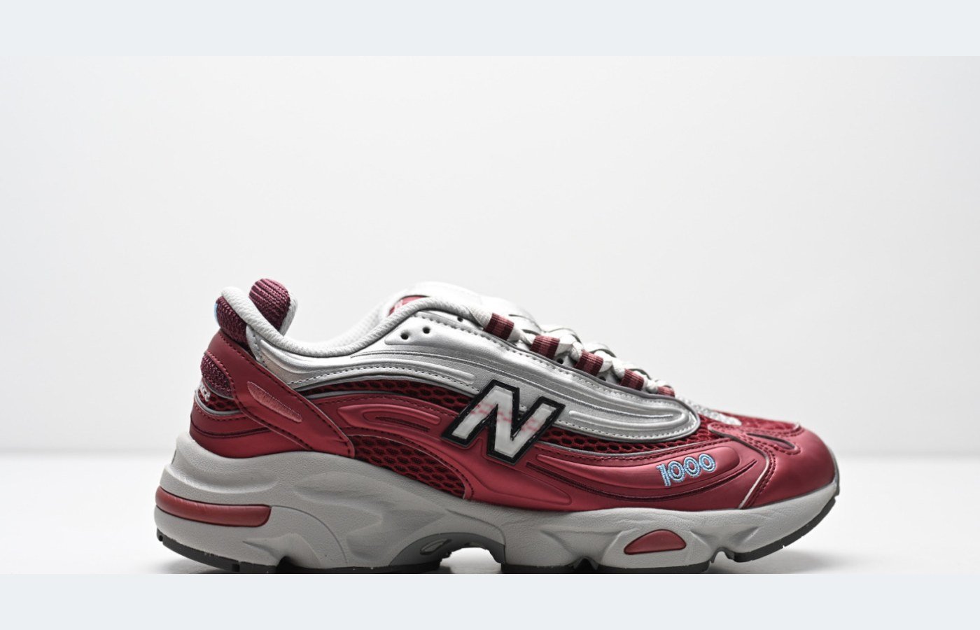 New Balance 1000 – Gris / Bordeaux