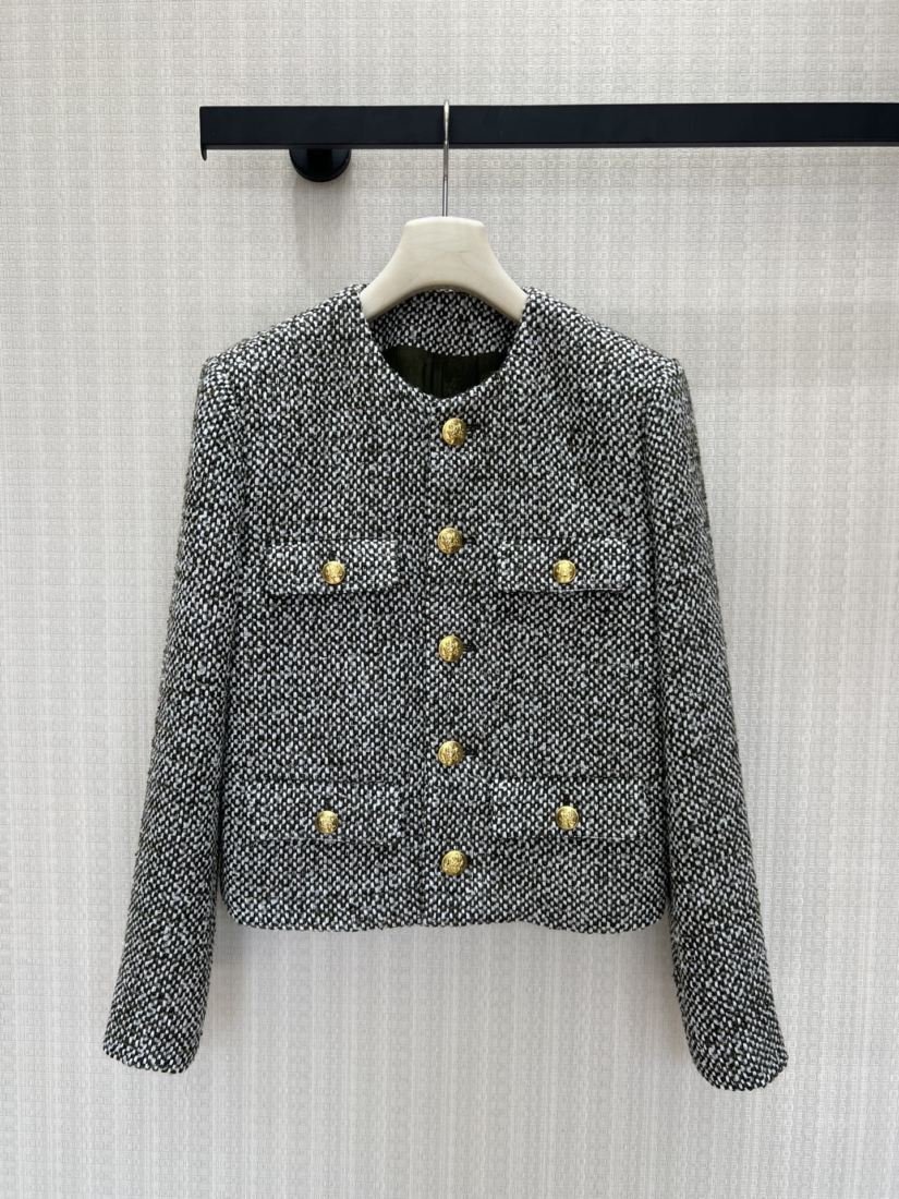 Chanel Veste courte en tweed noir et blanc à boutons dorés